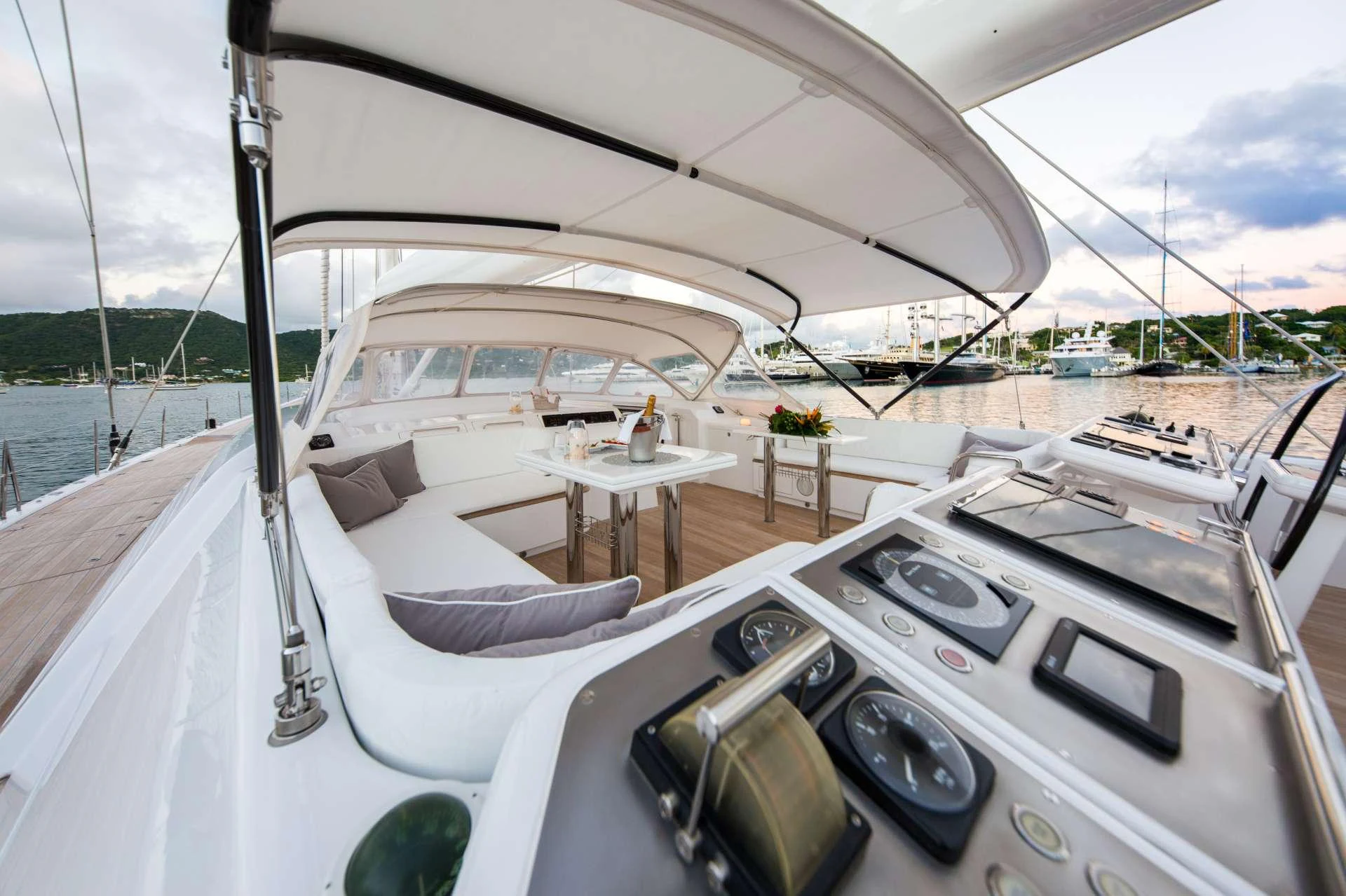 The flybridge offers a spacious and luxurious area for relaxation and navigation with stunning views of the marina. aboard SPIIP Yacht for Charter