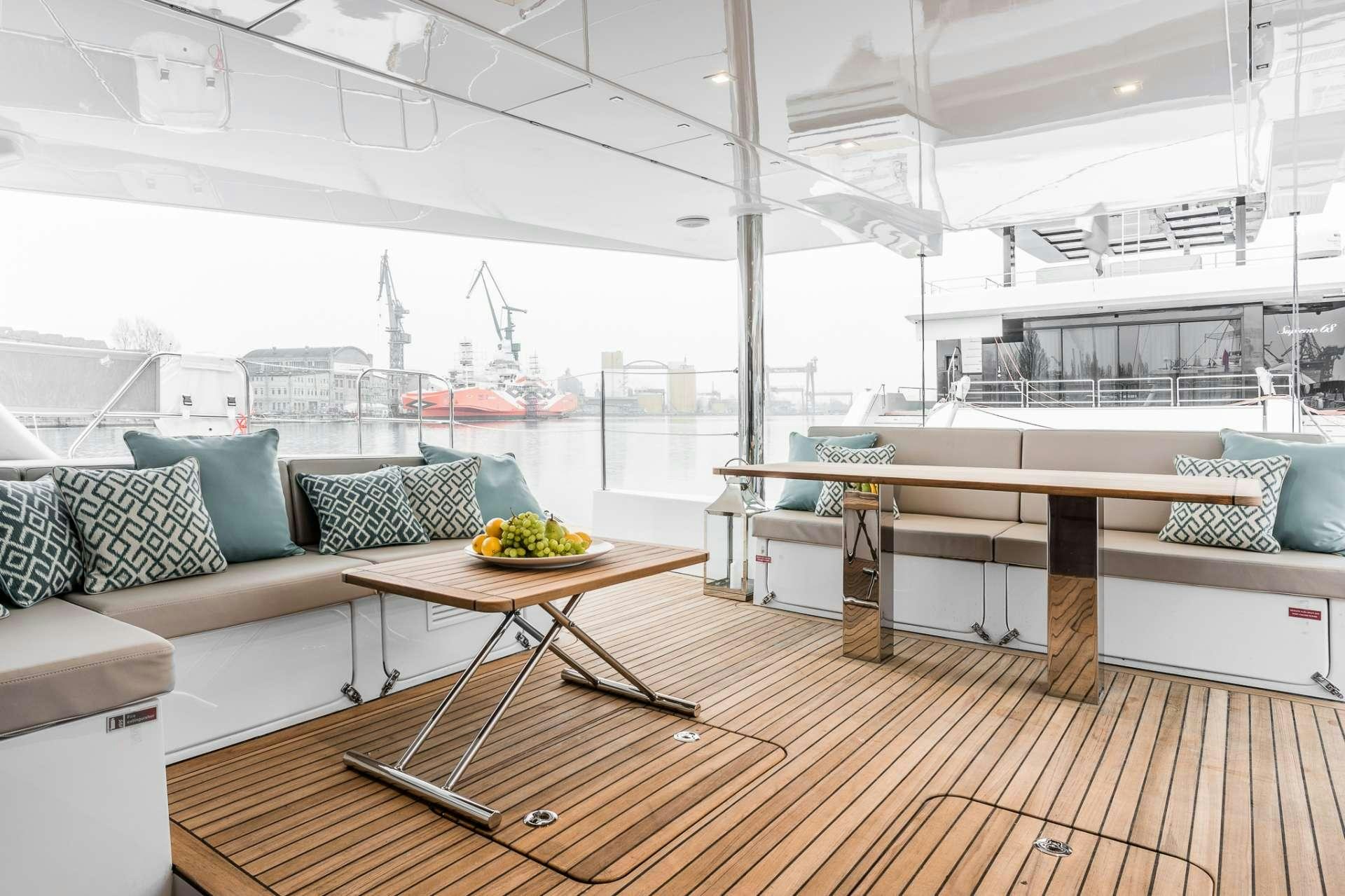 a living room with a large window aboard ANNETTE2 Yacht for Charter