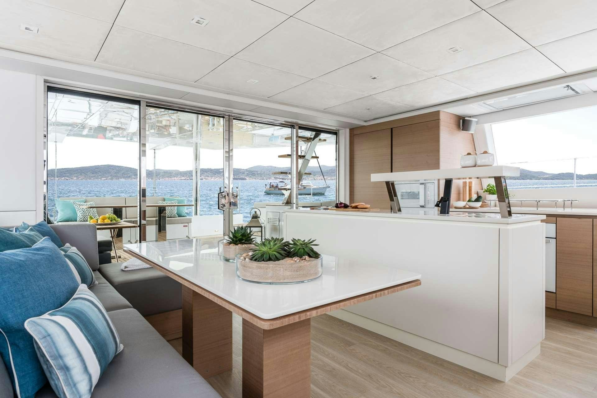 a modern kitchen with a large glass window aboard ANNETTE2 Yacht for Charter