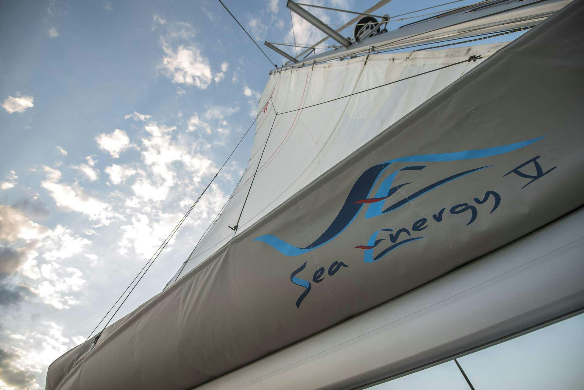 a sailboat with a blue sky aboard Sea Energy V Yacht for Charter