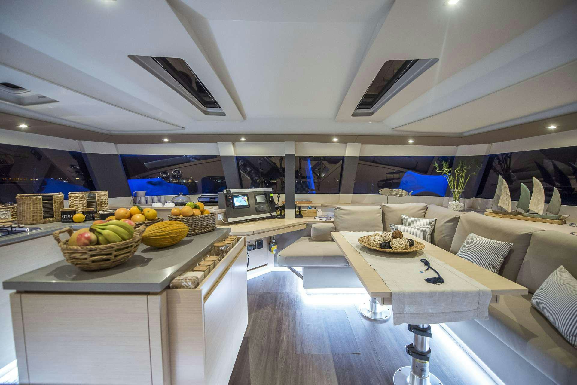 a room with a table and chairs aboard Sea Energy V Yacht for Charter