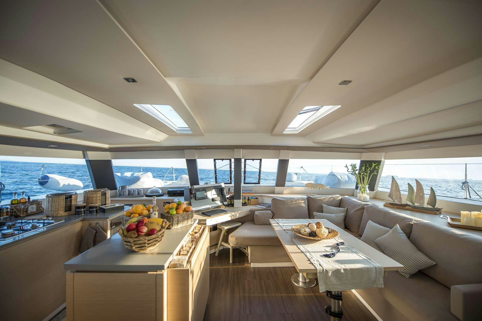 a room with a table and chairs aboard Sea Energy V Yacht for Charter
