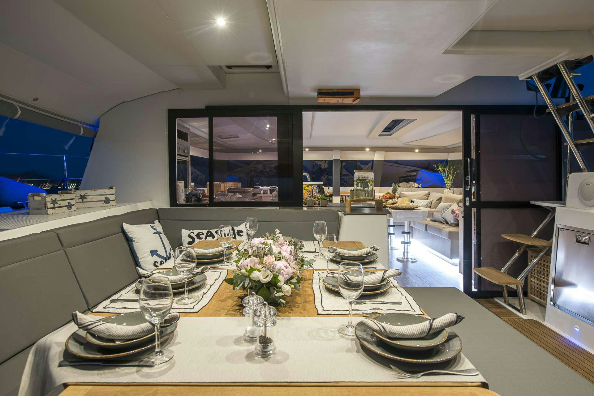 a table with plates and glasses on it aboard Sea Energy V Yacht for Charter