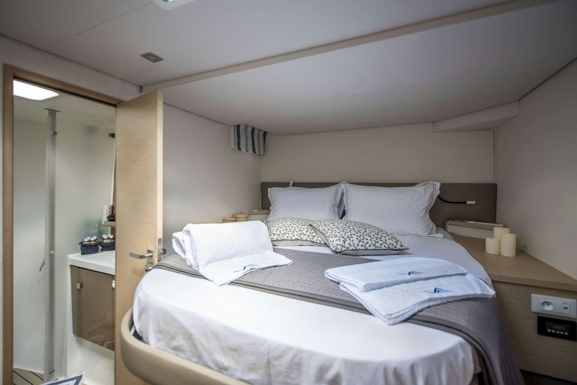 a hotel room with two beds aboard Sea Energy V Yacht for Charter