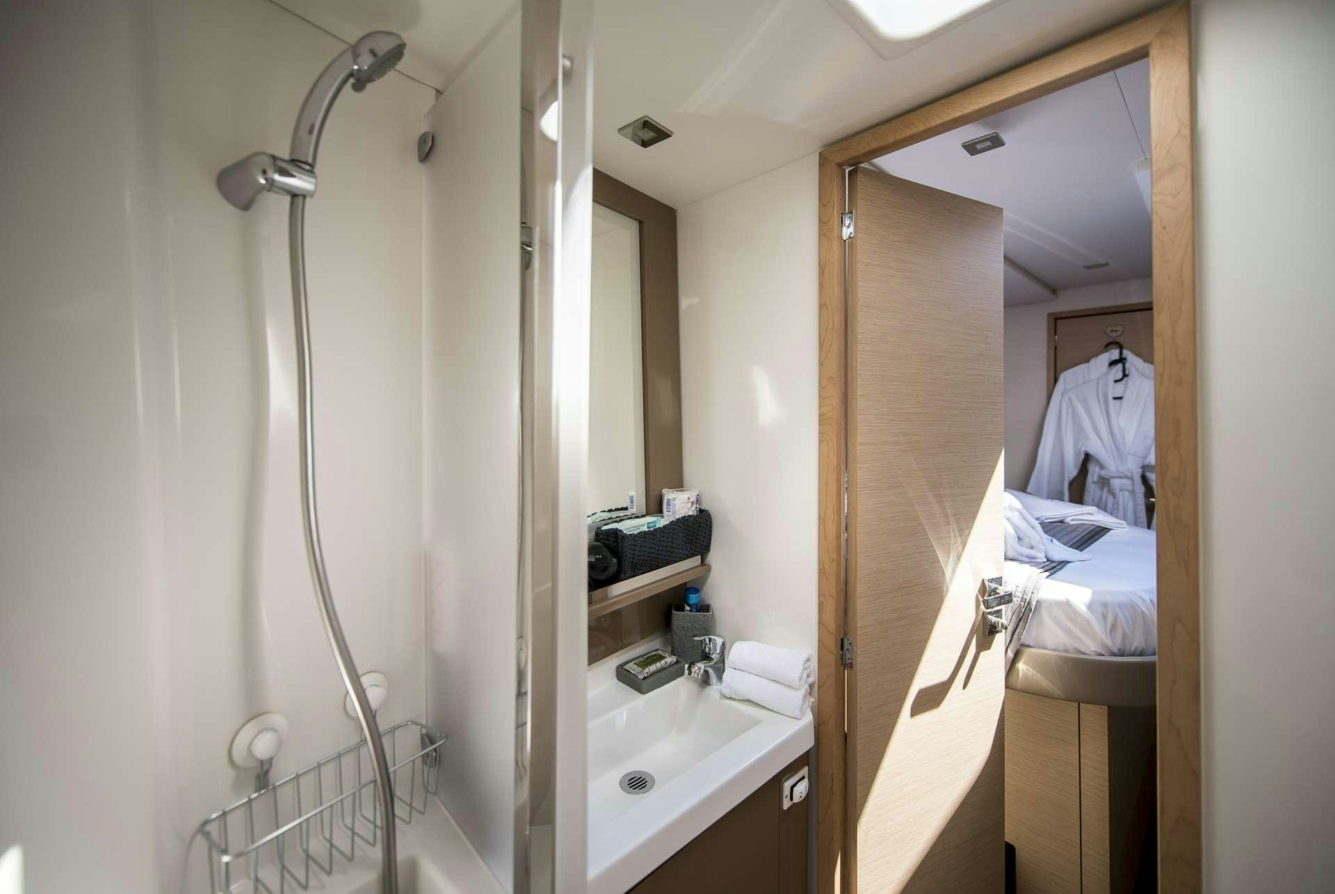 a person taking a picture of themselves in a mirror aboard Sea Energy V Yacht for Charter