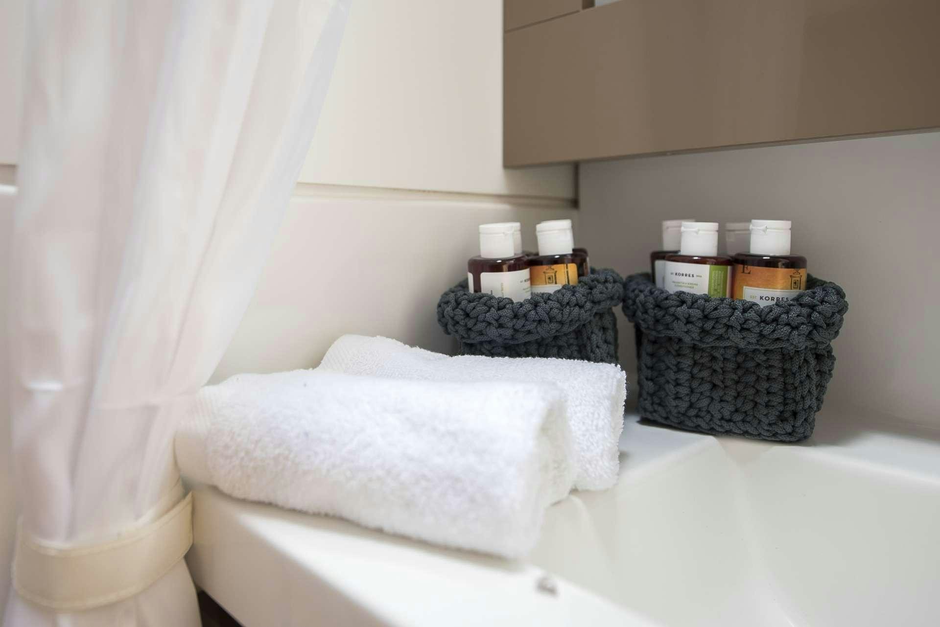 a bathroom with a tub and towels aboard Sea Energy V Yacht for Charter