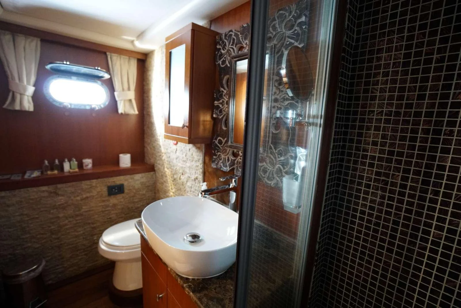 a bathroom with a sink and a shower aboard ARABELLA Yacht for Charter
