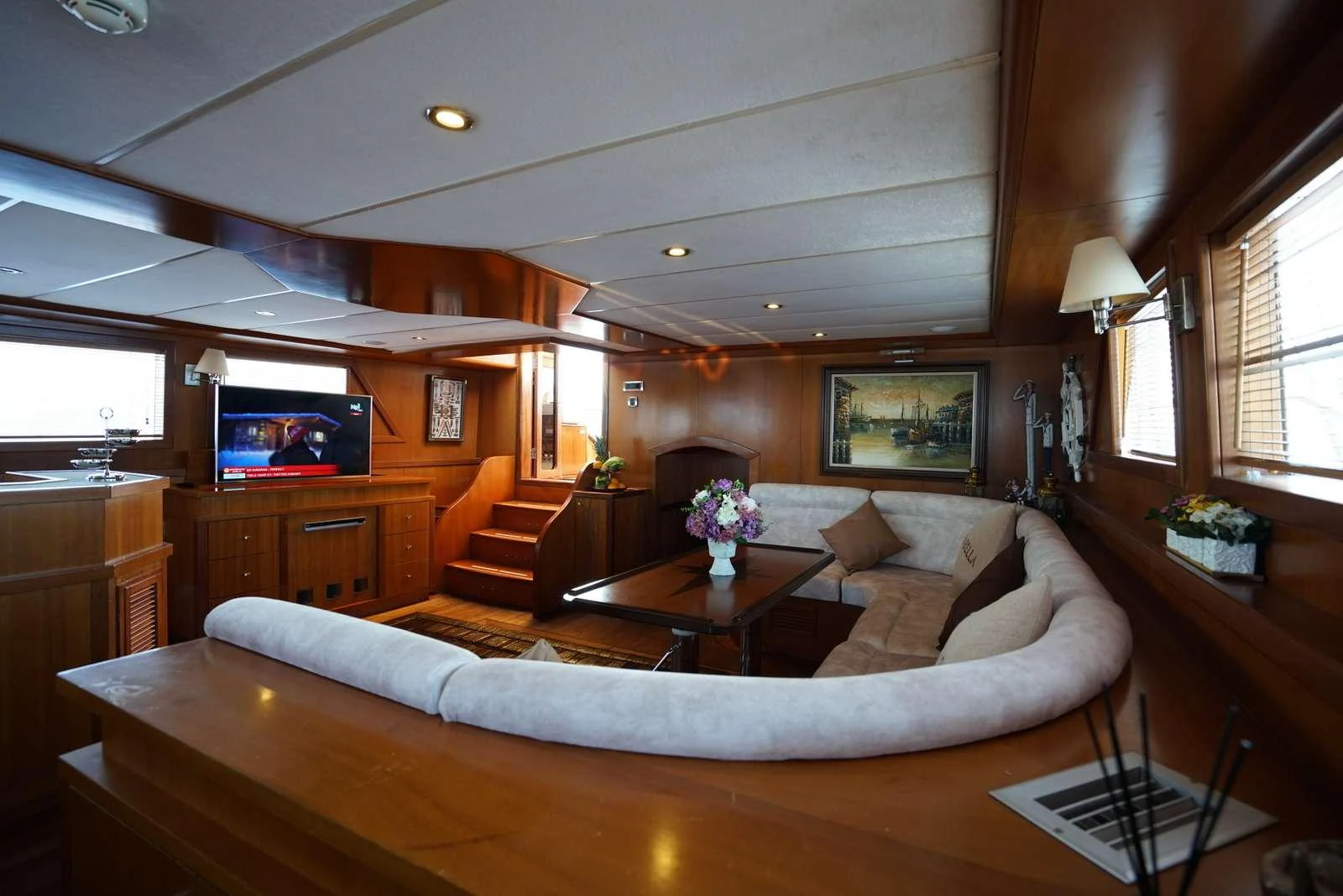 a living room with a large sofa aboard ARABELLA Yacht for Charter
