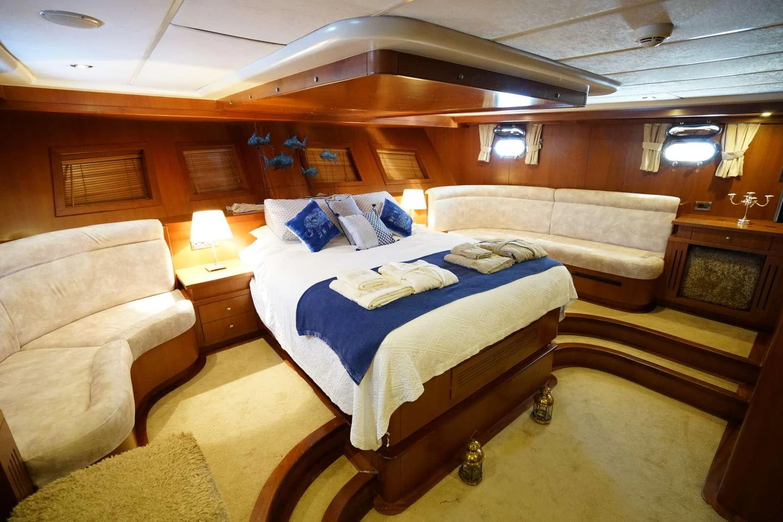 a room with a bed and a couch aboard ARABELLA Yacht for Charter