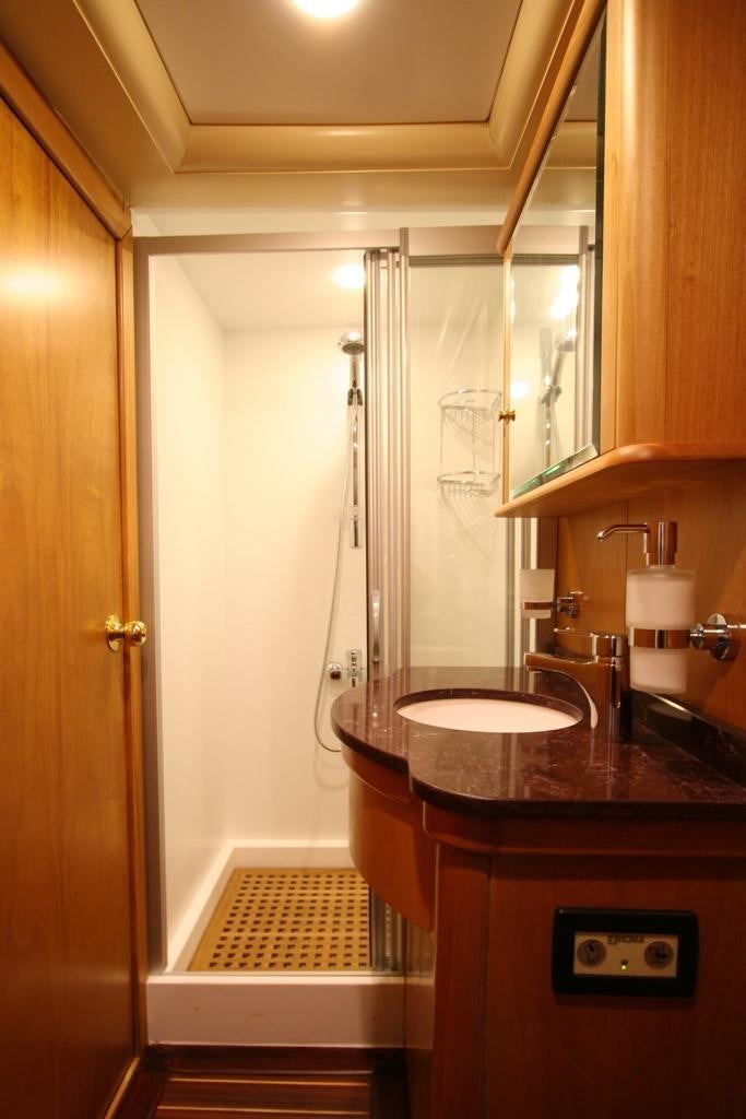 a bathroom with a sink and a shower aboard MEIN SCHATZ Yacht for Charter