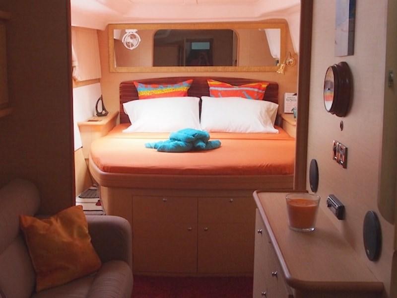 a bed with a pillow and a pillow on it aboard FRENK Yacht for Charter