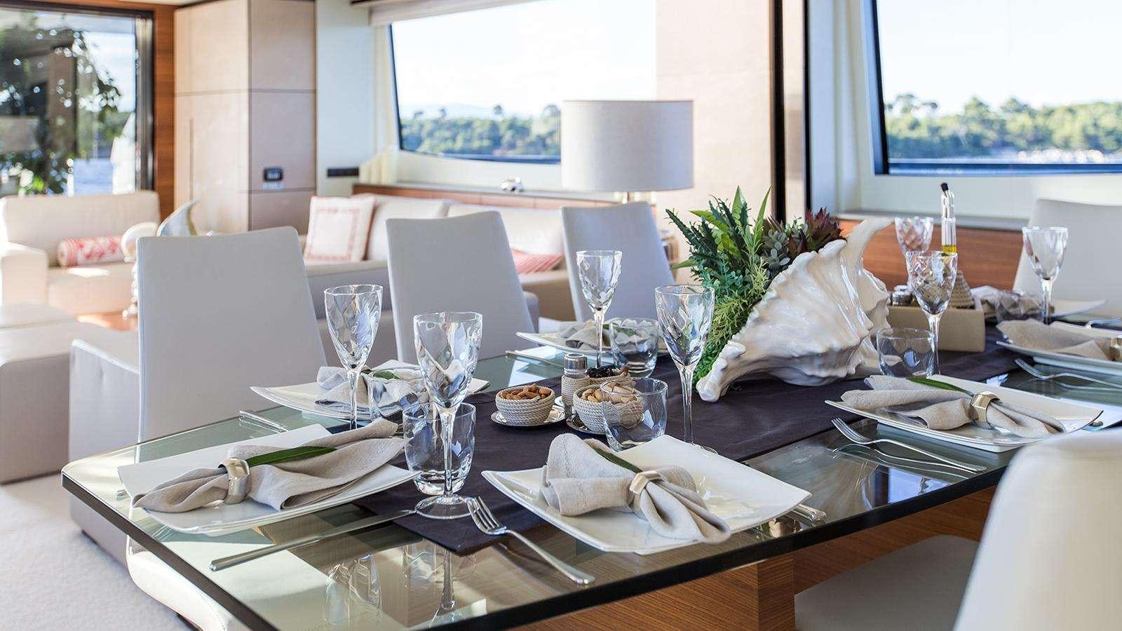 a table with place settings aboard KEROS ISLAND Yacht for Charter