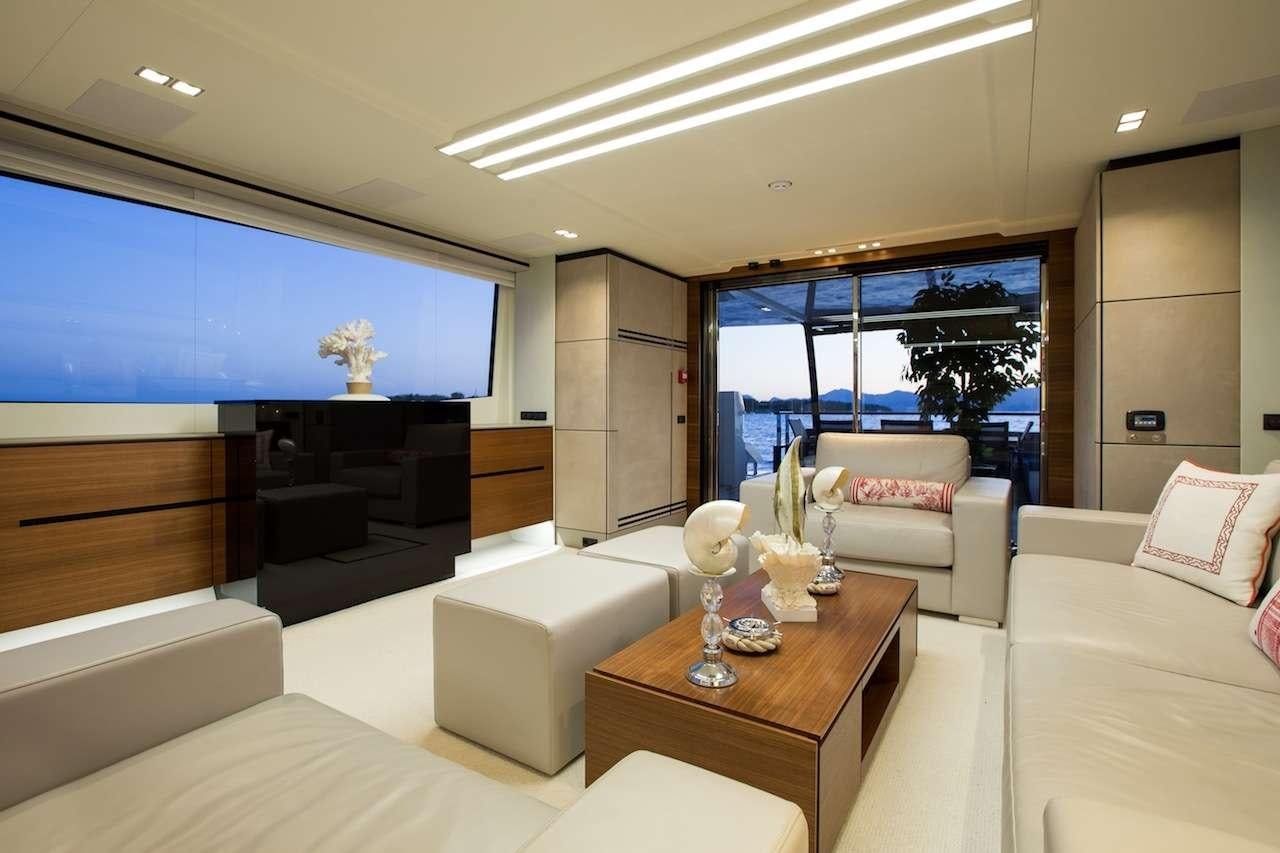 a living room with a large screen aboard KEROS ISLAND Yacht for Charter