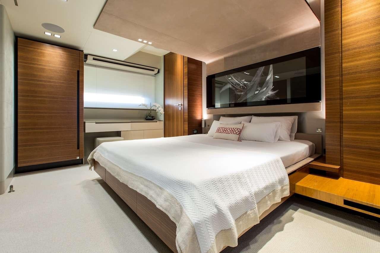 a large bed in a room aboard KEROS ISLAND Yacht for Charter