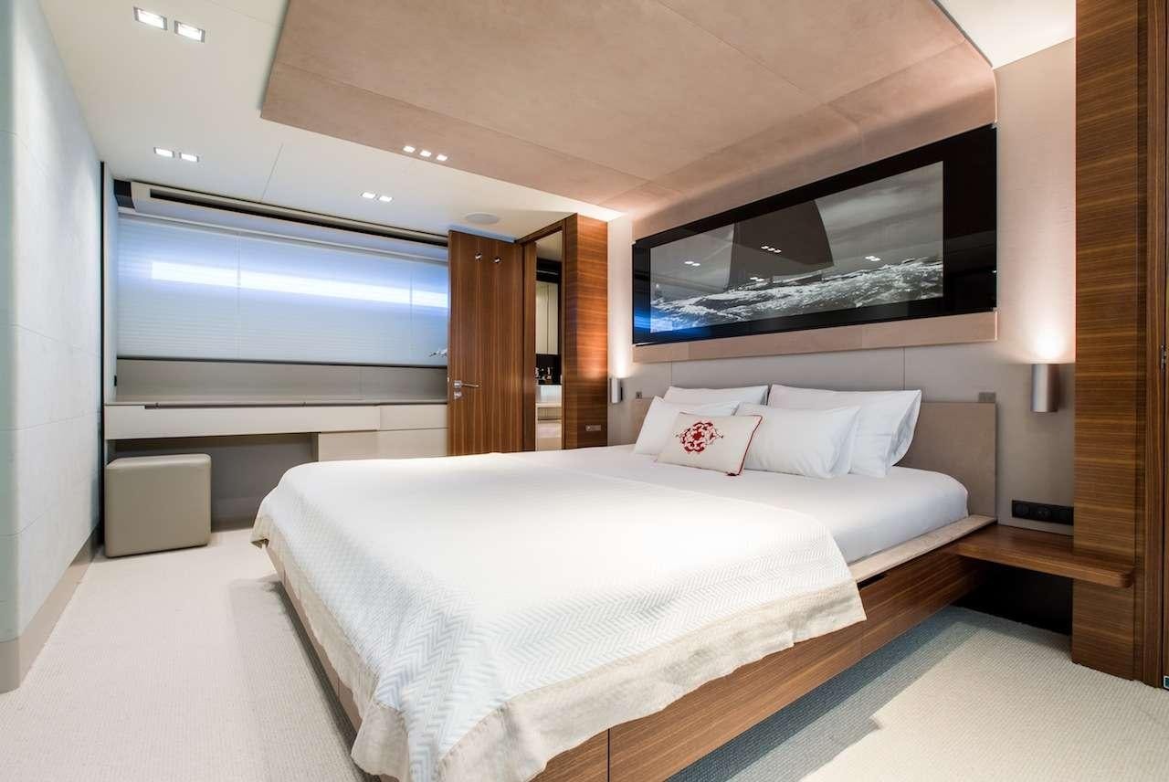 a large bed in a room aboard KEROS ISLAND Yacht for Charter