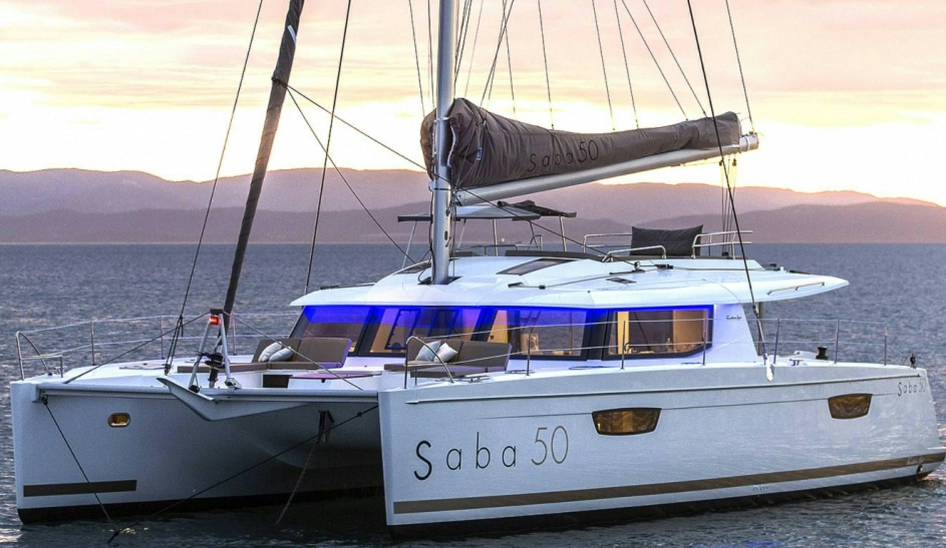 a couple of boats sit on a dock aboard MARIANN Yacht for Charter
