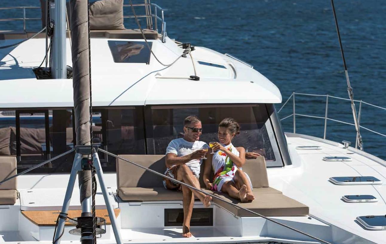 a man and a woman on a boat aboard MARIANN Yacht for Charter