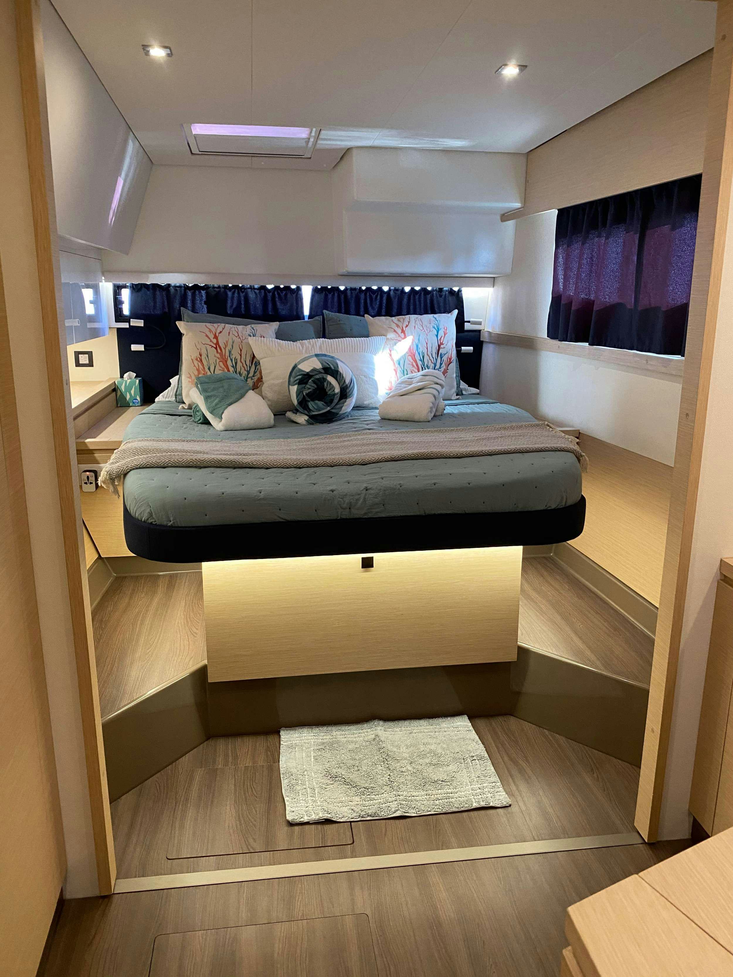 a bed in a room aboard MARIANN Yacht for Charter