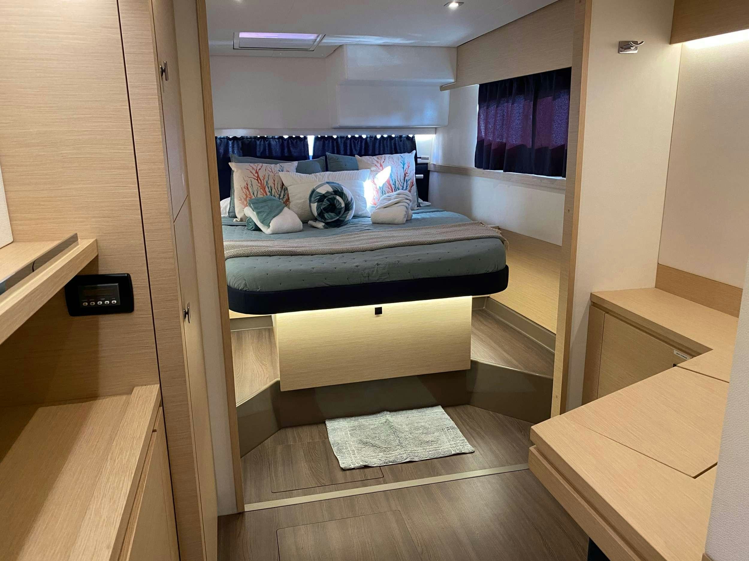 a bed in a room aboard MARIANN Yacht for Charter
