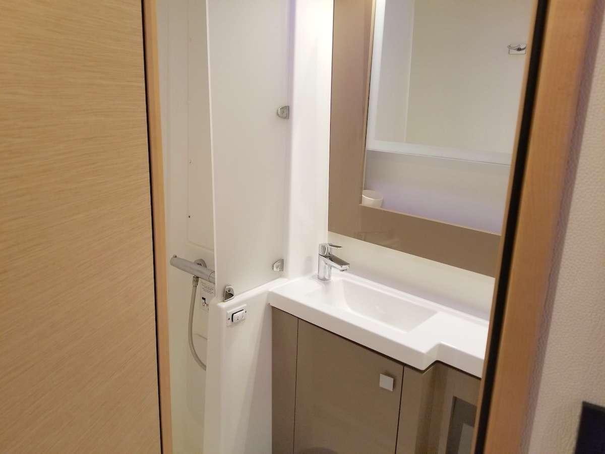 a bathroom with a white sink aboard MARIANN Yacht for Charter