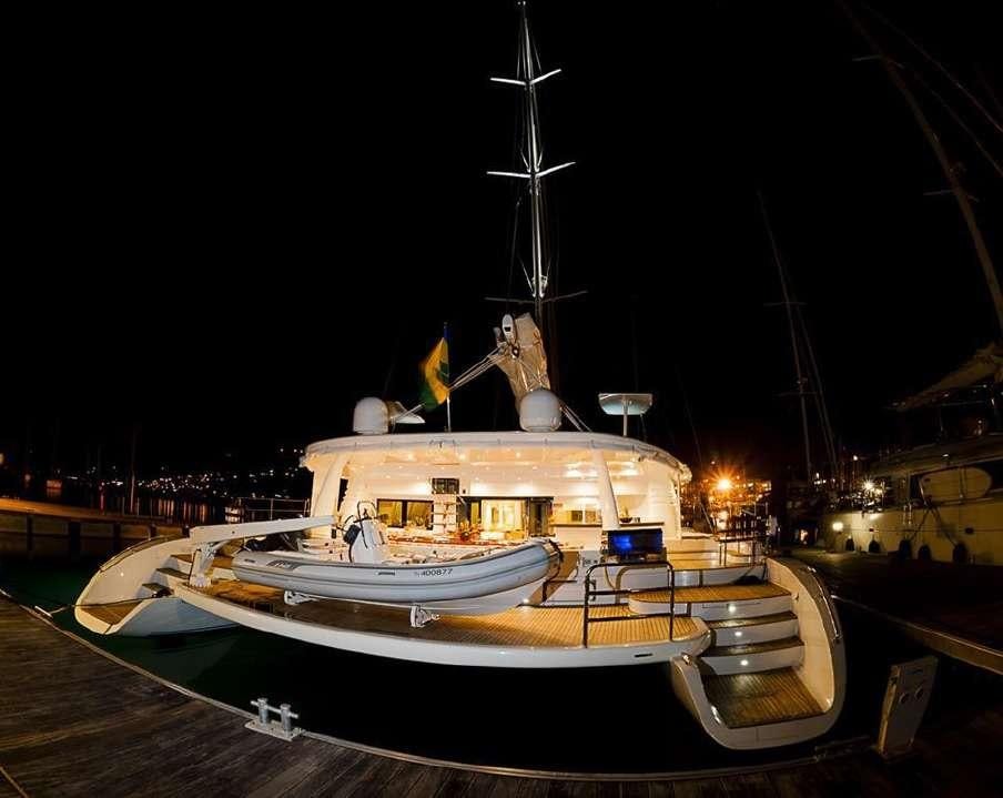 a boat docked at night aboard BLUE GRYPHON Yacht for Charter