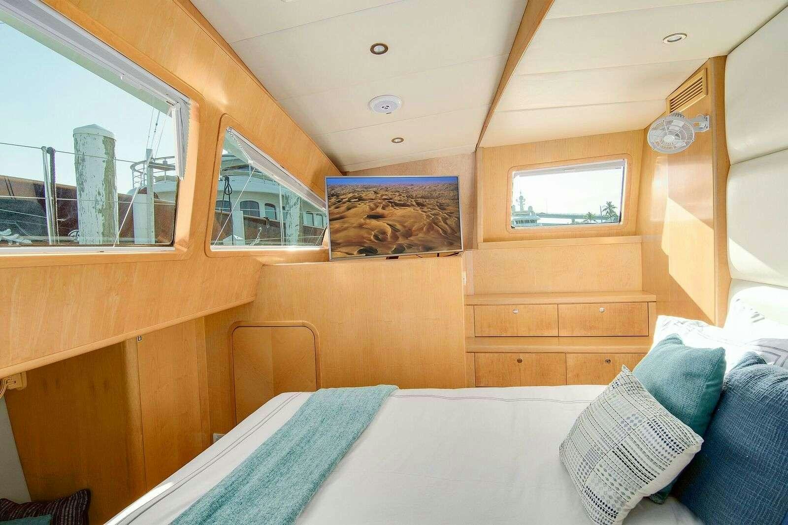 a cabin with a bed aboard BLUE GRYPHON Yacht for Charter