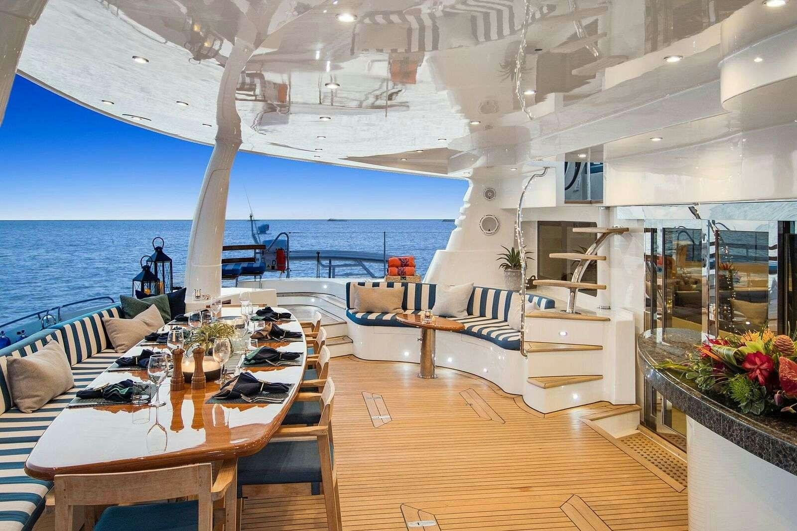 a room with a table and chairs aboard BLUE GRYPHON Yacht for Charter