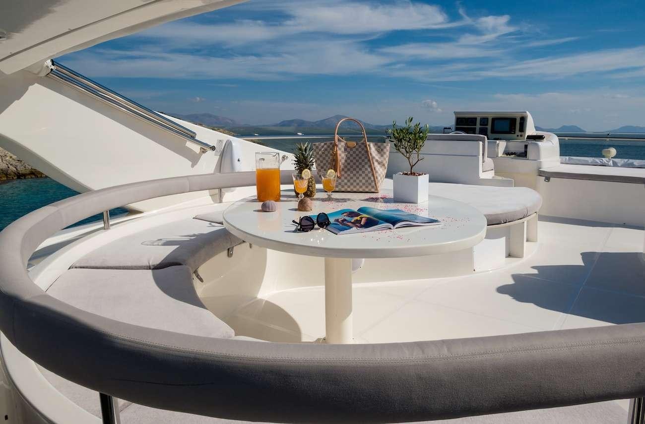 a white table with drinks on it aboard AMOR Yacht for Charter
