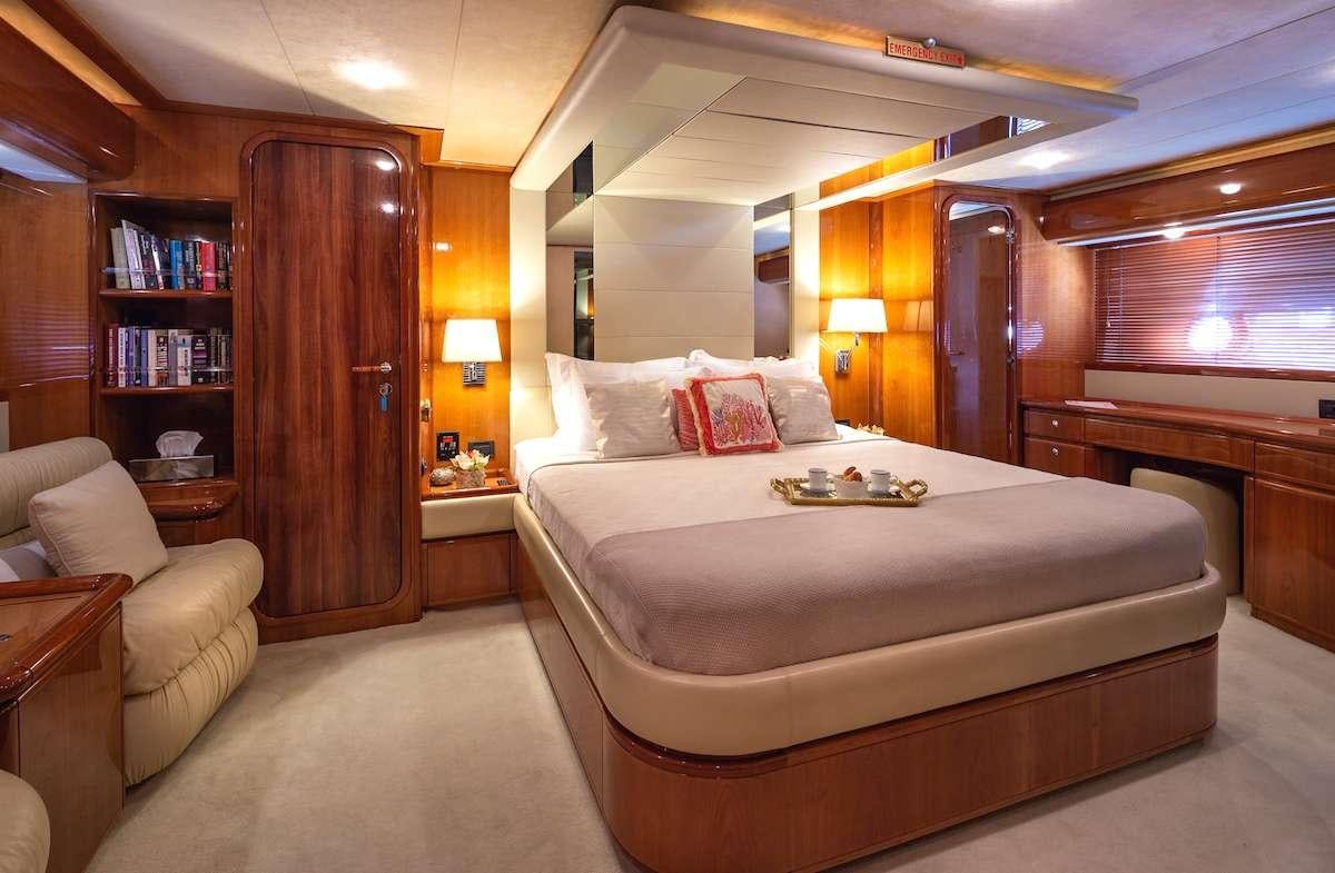 a large bedroom with a large bed aboard AMOR Yacht for Charter