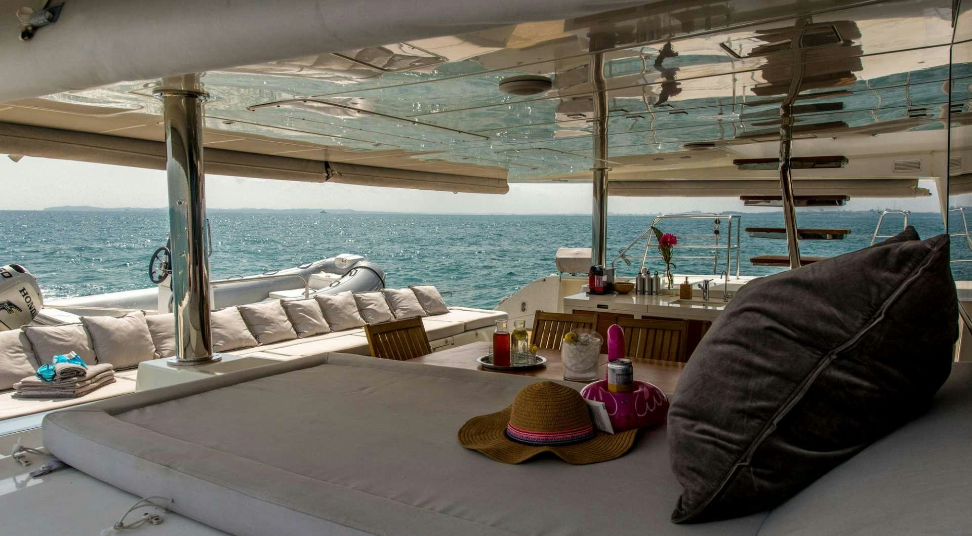 a boat with a hat and a hat on it aboard PRIMETIME Yacht for Charter