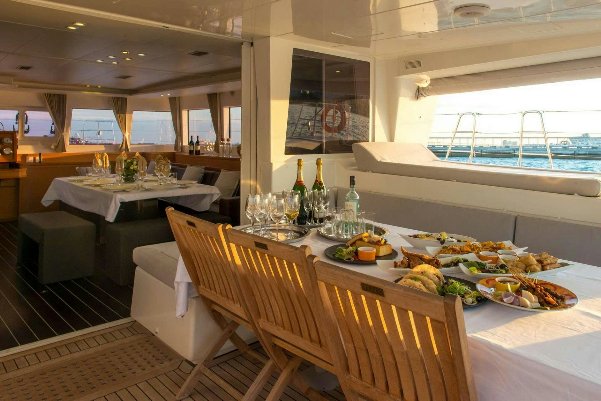 a table with food on it aboard PRIMETIME Yacht for Charter
