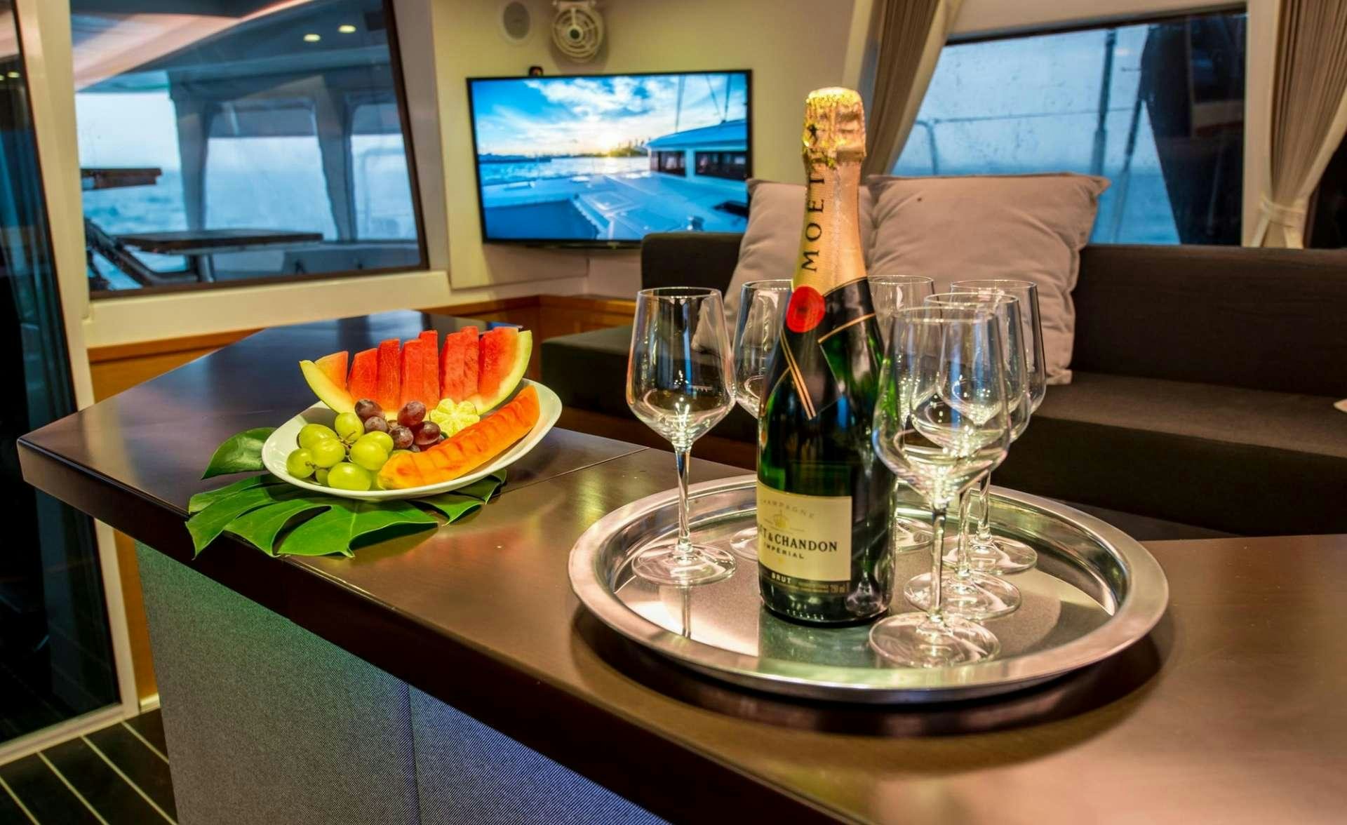 a bottle of wine on a table aboard PRIMETIME Yacht for Charter