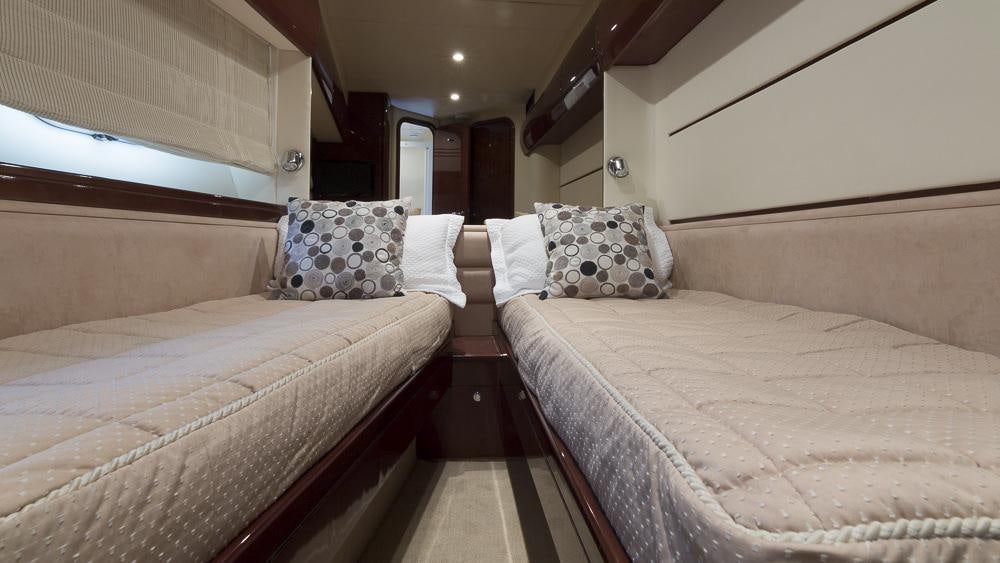 a room with two beds aboard ALL GOOD Yacht for Charter