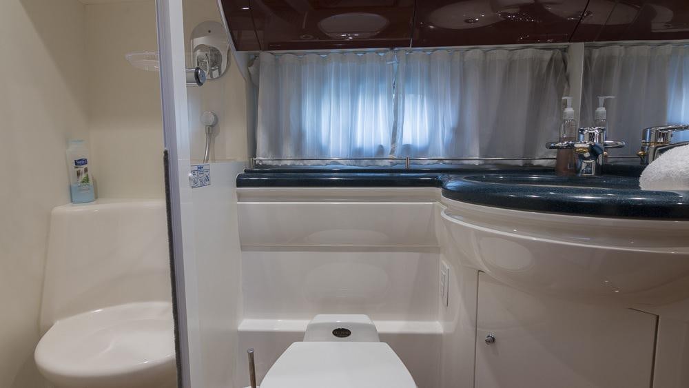 a bathroom with a sink and bathtub aboard ALL GOOD Yacht for Charter