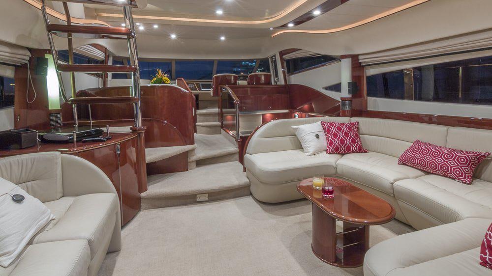 a room with a couch and a table aboard ALL GOOD Yacht for Charter