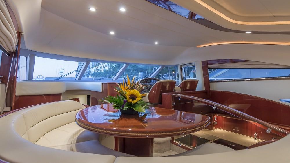 a room with a table and chairs aboard ALL GOOD Yacht for Charter
