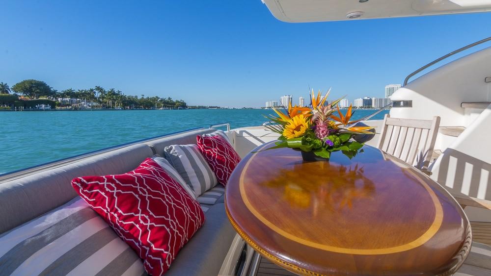 a table with a flower on it aboard ALL GOOD Yacht for Charter