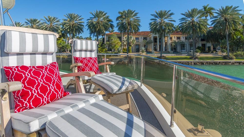 a pool with chairs and a table aboard ALL GOOD Yacht for Charter
