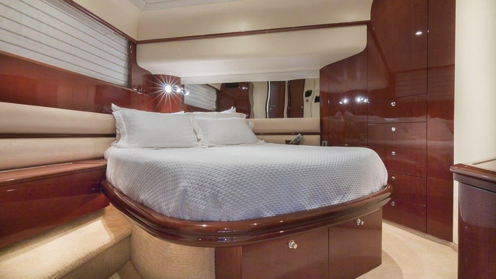 a bed with white sheets aboard ALL GOOD Yacht for Charter