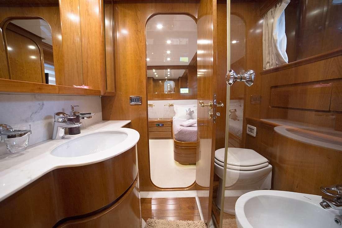 a bathroom with a sink toilet and a shower aboard ROCK MOON Yacht for Charter