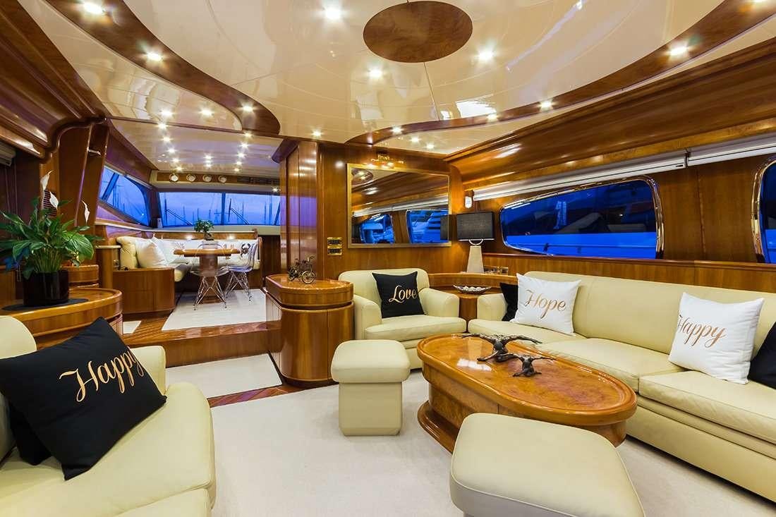 a living room with a large window aboard ROCK MOON Yacht for Charter