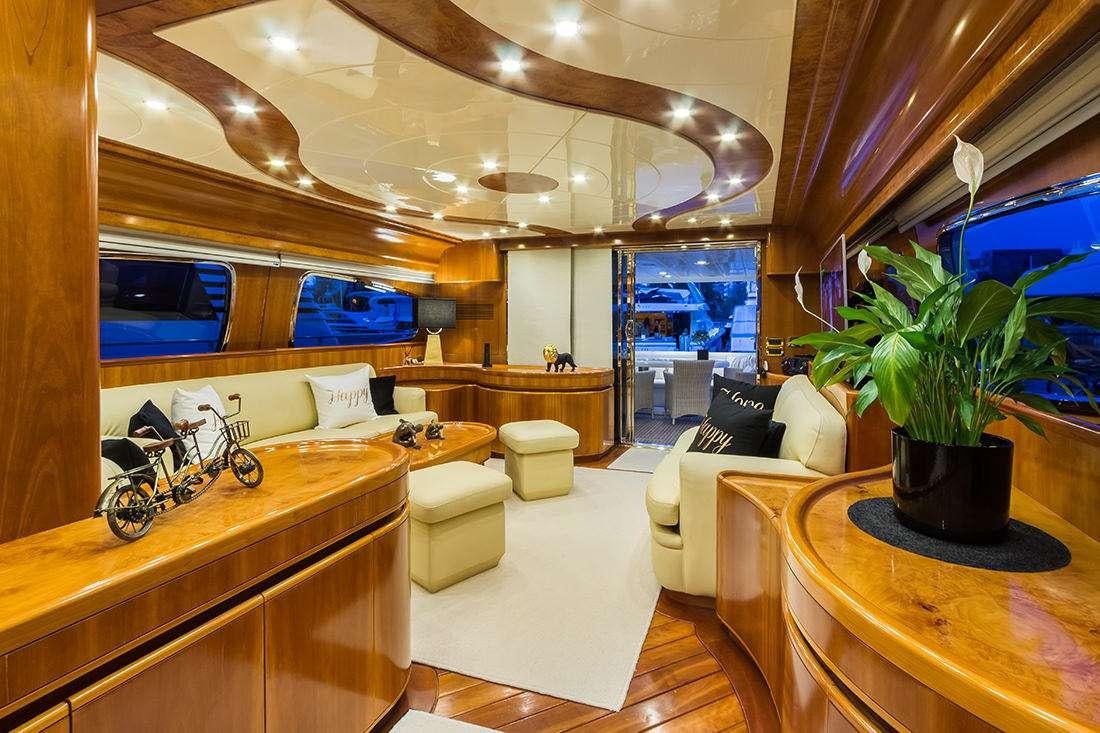 a room with a large mirror and a couch aboard ROCK MOON Yacht for Charter