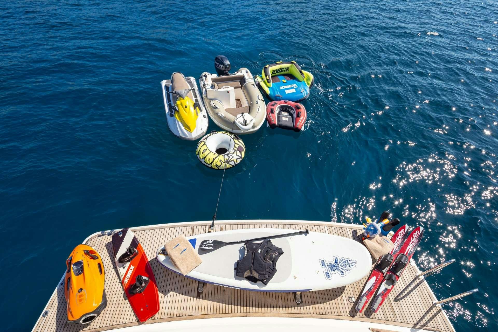 a boat with a group of boats on it aboard ROCK MOON Yacht for Charter