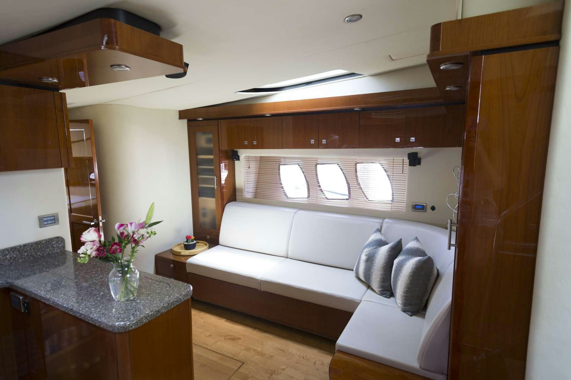 a living room with a couch and a table aboard ANOTHER CHANCE II Yacht for Charter