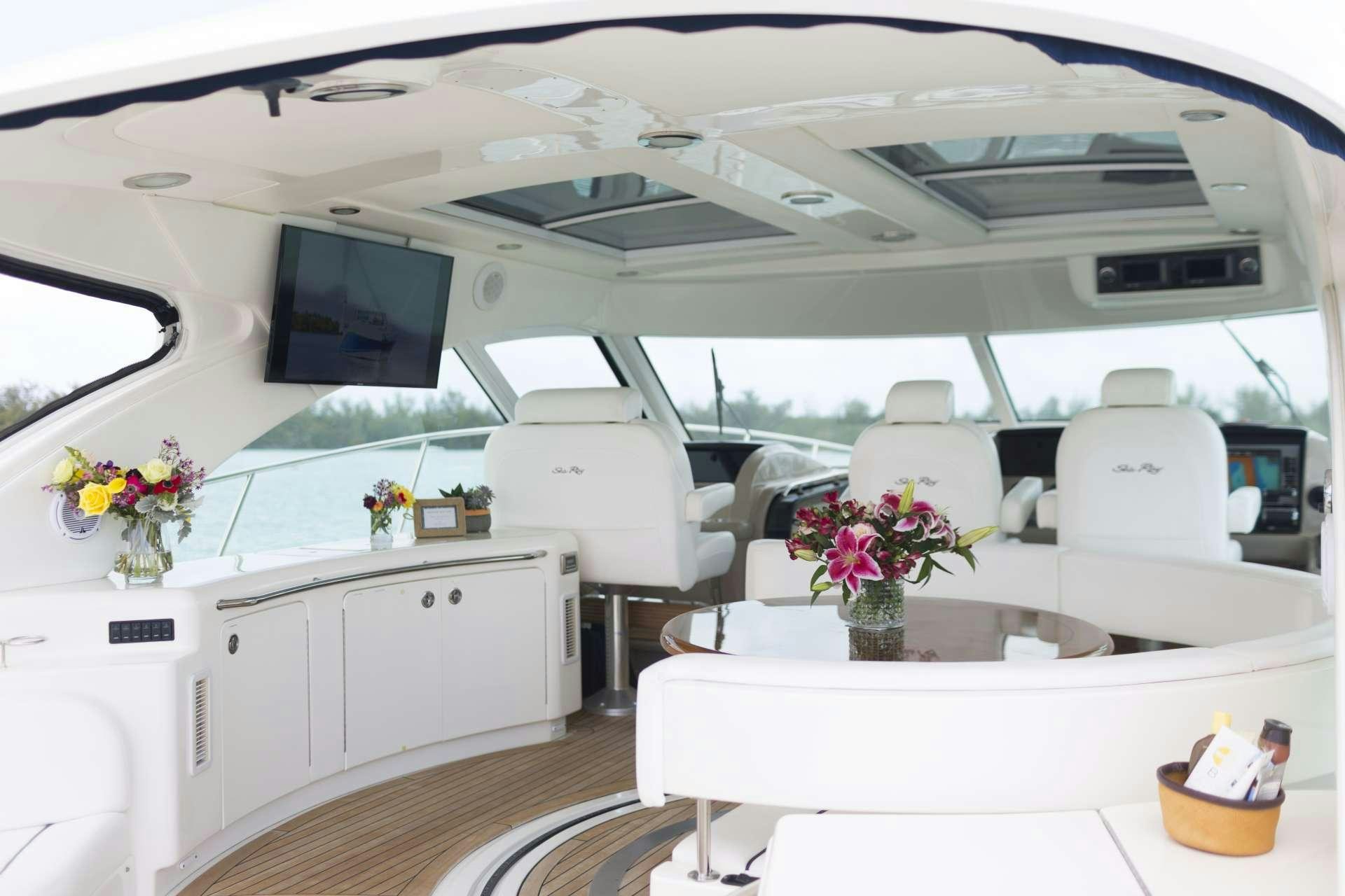 a white yacht with a table and chairs aboard ANOTHER CHANCE II Yacht for Charter
