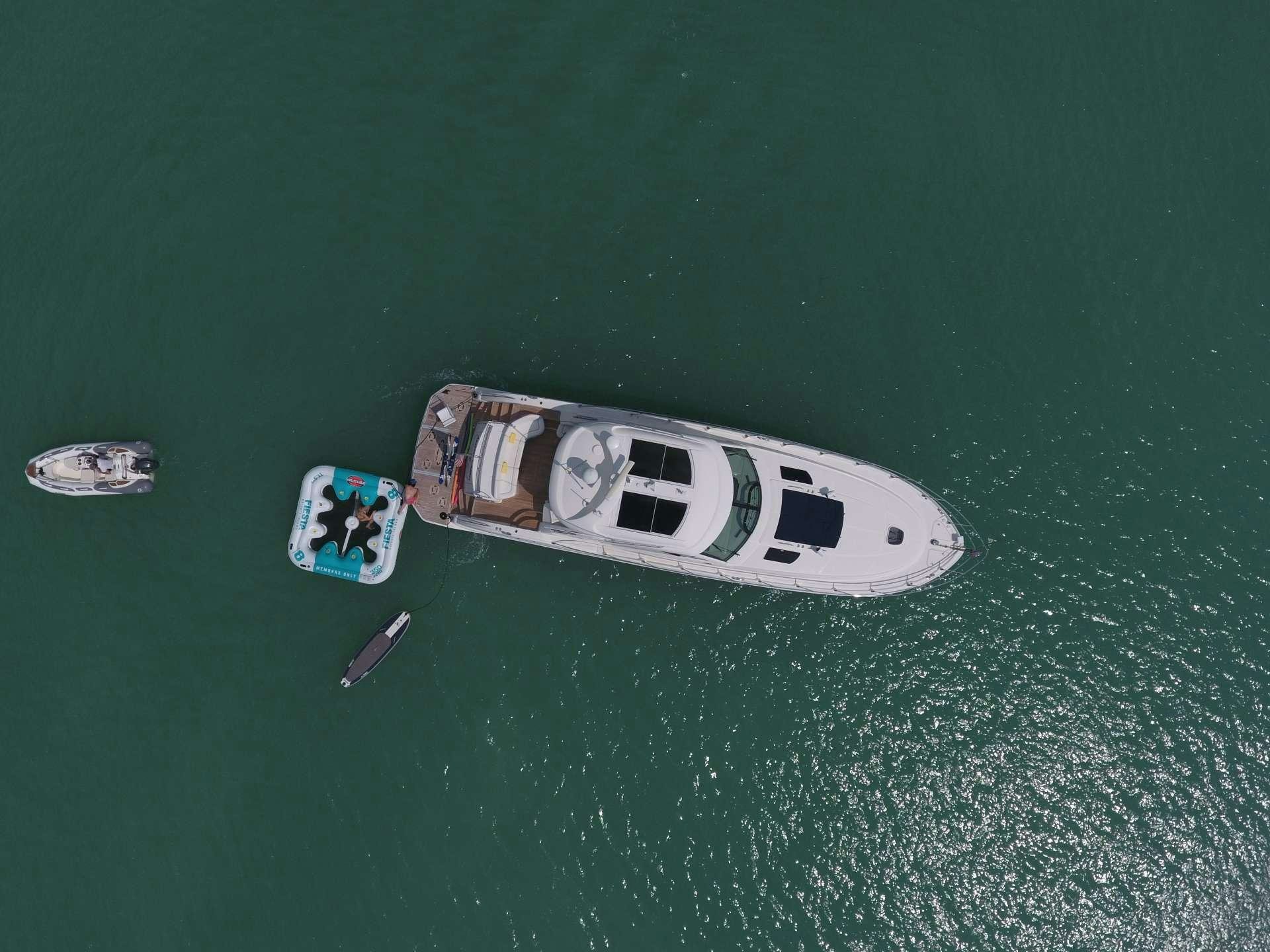 a boat with a couple of people on it aboard ANOTHER CHANCE II Yacht for Charter