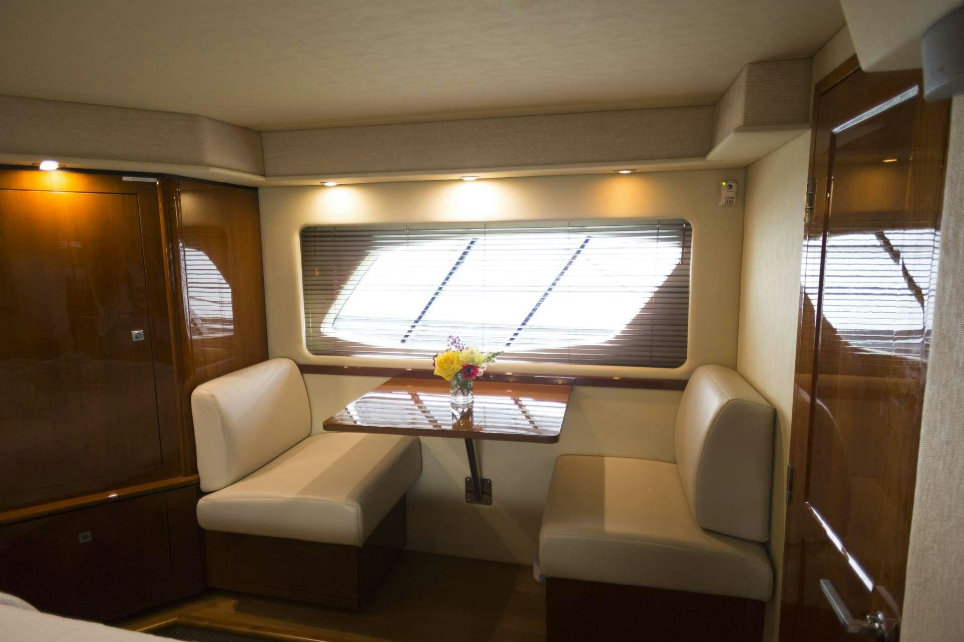 a table and chairs in a room aboard ANOTHER CHANCE II Yacht for Charter