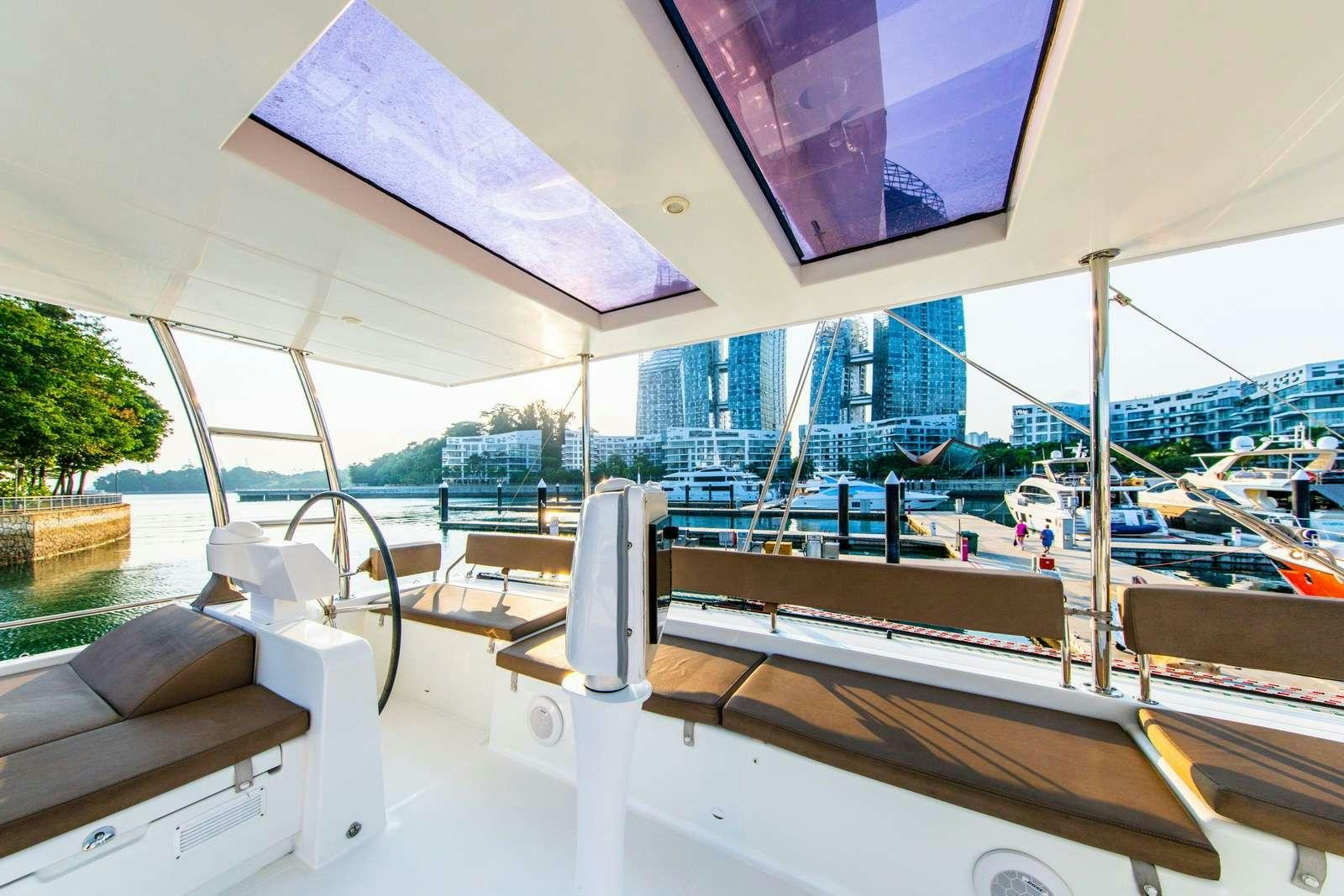 a room with a table and chairs aboard JYOHANA Yacht for Charter