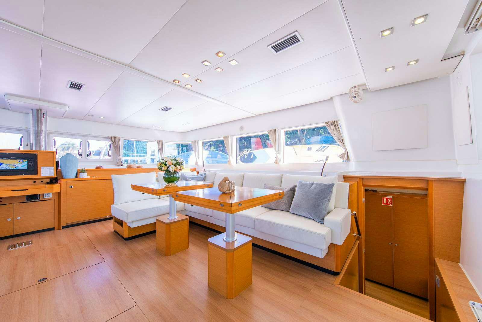 a room with a couch and a table aboard JYOHANA Yacht for Charter