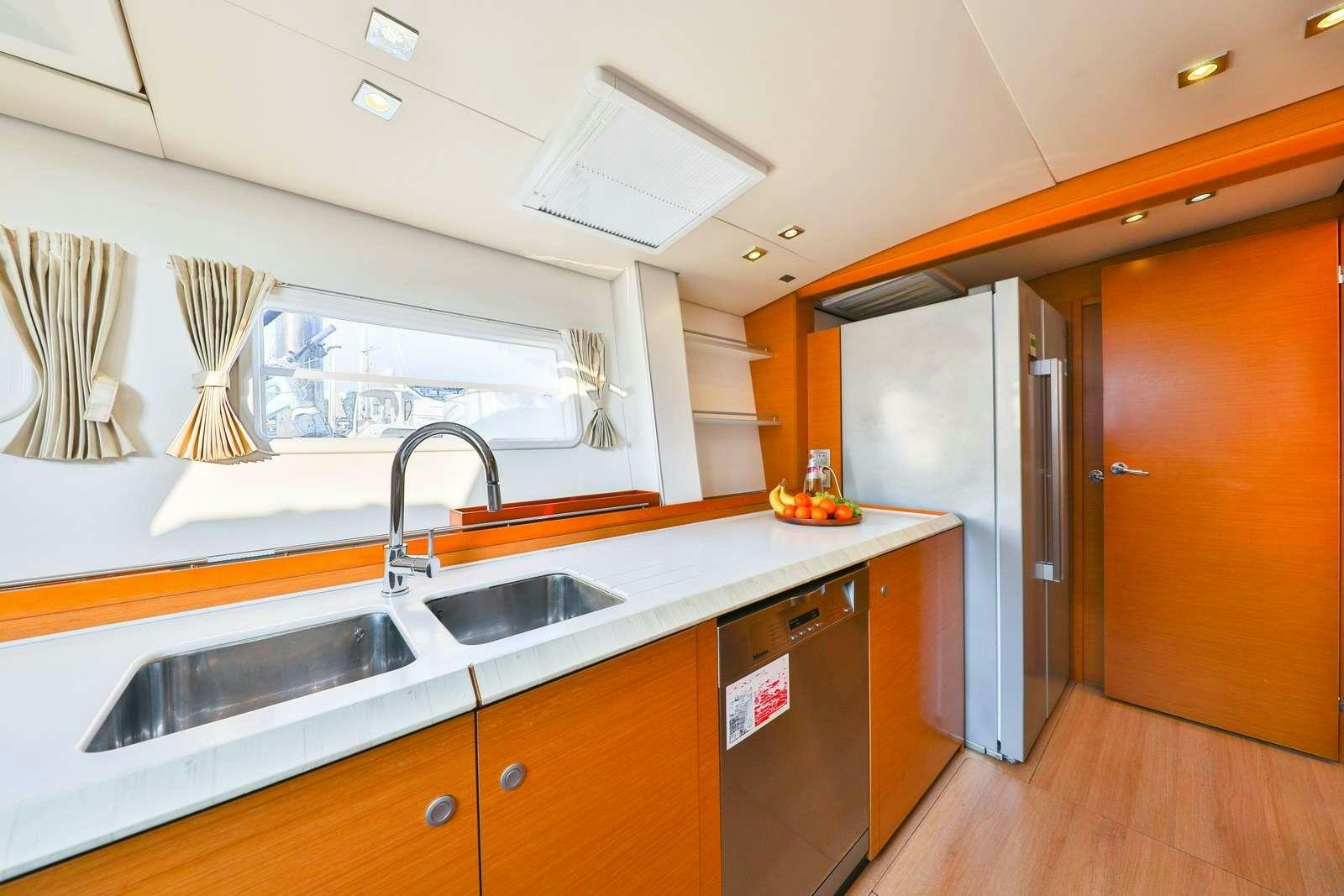 a kitchen with a large island aboard JYOHANA Yacht for Charter